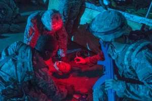 Soldiers of the 431st Quartermaster Detachment, based out of Kinston, N.C., insert a nasopharyngeal airway into a mannequin casualty during their tactical combat lifesaver recertification course at the Medical Simulation Training Center, in Fort Bragg, N.C., June 11. The 431st QM Det. participates in these real-life medical simulations as part of the 2014 Quartermaster Liquid Logistics Exercise (QLLEX), operationally controlled by the 633rd Quartermaster Battalion here. (U.S. Army photo by Sgt. Dalton Smith/Released)