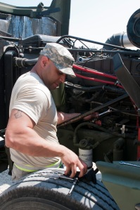Sgt. Gabriel Medrano, a light-wheeled vehicle mechanic with the 773rd Transportation Company, based in Fort Totten N.Y., repairs a diesel engine during the 2014 Quartermaster Liquid Logistics Exercise (QLLEX), operationally controlled by the 633rd Quartermaster Battalion here, at Fort Bragg, N.C. June 11, 2014. (U.S. Army photo by Sgt. Michael T. Crawford/Released)